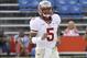 Nov 30, 2013; Gainesville, FL, USA; Florida State Seminoles quarterback Jameis Winston (5) runs out onto the field before he works out prior to the game against the Florida Gators at Ben Hill Griffin Stadium. Mandatory Credit: Kim Klement-USA TODAY Sports