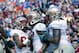 Nov 30, 2013; Gainesville, FL, USA; Florida State Seminoles wide receiver Kelvin Benjamin (1) is congratulated by wide receiver Rashad Greene (80), offensive linesman Bobby Hart (51) and teammates after he scored a touchdown against the Florida Gators dur