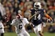 Nov 30, 2013; Auburn, AL, USA; Auburn Tigers quarterback Nick Marshall (14) runs against Alabama Crimson Tide defensive back Ha Ha Clinton-Dix (6) during the fourth quarter at Jordan Hare Stadium. Mandatory Credit: John Reed-USA TODAY Sports