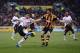 HULL, ENGLAND - DECEMBER 01: Luis Suarez of Liverpool takes on Alex Bruce of Hull City during the Barclays Premier League match between Hull City and Liverpool at KC Stadium on December 1, 2013 in Hull, England. (Photo by Jamie McDonald/Getty Images)