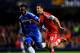 LONDON, ENGLAND - DECEMBER 01: Adam Lallana of Southampton is chased by Michael Essien of Chelsea during the Barclays Premier League match between Chelsea and Southampton at Stamford Bridge on December 1, 2013 in London, England. (Photo by Mike Hewitt/G