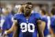 Sep 8, 2013; Arlington, TX, USA; New York Giants defensive end Jason Pierre-Paul (90) on the sidelines during the fourth quarter of the game against the Dallas Cowboys at AT&T Stadium. The Dallas Cowboys beat the New York Giants 36-31. Mandatory Credit: