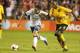 KANSAS CITY, KS - OCTOBER 11: Graham Zusi #19 of the U.S. Men's National Soccer Team fends off Lloyd Doyley #3 of the Jamaica late in the second half at Sporting Park on October 11, 2013 in Kansas City, Kansas. (Photo by Kyle Rivas/Getty Images)
