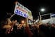 Nov 30, 2013; Auburn, AL, USA; A fan holds up a sign at Toomer's Corner after the game between the Alabama Crimson Tide and the Auburn Tigers at Jordan Hare Stadium. The Tigers defeated the Crimson Tide 34-28. Mandatory Credit: Shanna Lockwood-USA TODAY S
