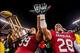 Nov 30, 2013; Columbia, SC, USA; South Carolina Gamecocks defensive tackle Kelcy Quarles (99) and South Carolina Gamecocks linebacker Jonathan Walton (28) celebrate with the Hardee's trophy for defeating the Clemson Tigers at Williams-Brice Stadium. Manda