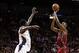 Dec 1, 2013; Miami, FL, USA; Miami Heat center Chris Bosh (1) shoots the ball over Charlotte Bobcats small forward Michael Kidd-Gilchrist (14) in the second half at American Airlines Arena. The Heat won 99-98. Mandatory Credit: Robert Mayer-USA TODAY Spo