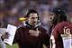 Dec 1, 2013; Landover, MD, USA; Washington Redskins offensive coordinator Kyle Shanahan talks with Redskins quarterback Robert Griffin III (10) on the sidelines against the New York Giants in the second quarter at FedEx Field. Mandatory Credit: Geoff Bur