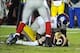 Dec 1, 2013; Landover, MD, USA; Washington Redskins quarterback Robert Griffin III (10) is sacked by New York Giants defensive end Justin Tuck (91) during the second half at FedEx Field. The Giants won 24 - 17. Mandatory Credit: Brad Mills-USA TODAY Sport
