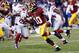 Dec 1, 2013; Landover, MD, USA; Washington Redskins quarterback Robert Griffin III (10) runs with the ball against the New York Giants in the first quarter at FedEx Field. Mandatory Credit: Geoff Burke-USA TODAY Sports