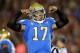 LOS ANGELES, CA - NOVEMBER 30: Quarterback Brett Hundley #17 of the UCLA Bruins flexes as he celebrates a Myles Jack three yard touchdown run in the first quarter against the USC Trojans at Los Angeles Coliseum on November 30, 2013 in Los Angeles, Califo