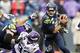 Nov 17, 2013; Seattle, WA, USA; Seattle Seahawks quarterback Russell Wilson (3) scrambles away from pressure by the Minnesota Vikings during the fourth quarter at CenturyLink Field. Mandatory Credit: Joe Nicholson-USA TODAY Sports