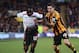 HULL, ENGLAND - DECEMBER 01: Victor Moses of Liverpool is tackled by Robert Koren of Hull City during the Barclays Premier League match between Hull City and Liverpool at KC Stadium on December 1, 2013 in Hull, England. (Photo by Jamie McDonald/Getty Ima