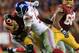 LANDOVER, MD - DECEMBER 01: Defensive end Justin Tuck #91 of the New York Giants sacks quarterback Robert Griffin III #10 of the Washington Redskins during the fourth quarter of the Giants 24-17 win at FedExField on December 1, 2013 in Landover, Maryland