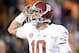 Nov 30, 2013; Auburn, AL, USA; Alabama Crimson Tide quarterback AJ McCarron (10) celebrates after a 99 yard touchdown by wide receiver Amari Cooper (not pictured) against the Auburn Tigers during the fourth quarter at Jordan Hare Stadium. Mandatory Credit