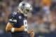 ARLINGTON, TX - NOVEMBER 28: Tony Romo #9 of the Dallas Cowboys celebrates a touchdown against the Oakland Raiders at AT&T Stadium on November 28, 2013 in Arlington, Texas. (Photo by Ronald Martinez/Getty Images)