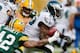 GREEN BAY, WI - NOVEMBER 10: LeSean McCoy #25 of the Philadelphia Eagles battles for yards during a fourth quarter run while being tackled by Morgan Burnett #42 of the Green Bay Packers at Lambeau Field on November 10, 2013 in Green Bay, Wisconsin. Philad