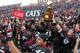 CINCINNATI, OH - DECEMBER 03: Rob Trigg #45 of the Cincinnati Bearcats holds the the Big East Championship Trophy as he celebrates with fans and teammates after the Bearcats defeated the Connecticut Huskies 35-27 to claim their share of the 2011 Big East
