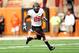 AUSTIN, TX - NOVEMBER 16: Desmond Roland #26 of the Oklahoma State Cowboys runs for yards against the Texas Longhorns during a game at Darrell K Royal-Texas Memorial Stadium on November 16, 2013 in Austin, Texas. Oklahoma State won the game 38-13. (Pho