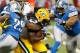 DETROIT, MI - NOVEMBER 28: Eddie Lacy #27 of the Green Bay Packers is tackled during a second quarter run by Ndamukong Suh #90 and Willie Young #79 of the Detroit Lionsat Ford Field on November 28, 2013 in Detroit, Michigan. (Photo by Gregory Shamus/Getty