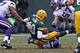 GREEN BAY, WI - NOVEMBER 24: Matt Flynn #10 of the Green Bay Packers is sacked by Chad Greenway #52 of the Minnesota Vikings at Lambeau Field on November 24, 2013 in Green Bay, Wisconsin. The Vikings and the Packers tied 26-26 after overtime. (Photo by