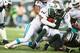 EAST RUTHERFORD, NJ - DECEMBER 01: Olivier Vernon #50 of the Miami Dolphins sacks Geno Smith #7 of the New York Jets during their game at MetLife Stadium on December 1, 2013 in East Rutherford, New Jersey. (Photo by Al Bello/Getty Images)