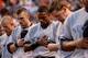 BALTIMORE, MD - SEPTEMBER 11: Left fielder Curtis Granderson #14 of the New York Yankees and teammates have a moment of silence to commemorate the 12th anniversary of September 11 before an MLB game against the Baltimore Orioles at Oriole Park at Camden Y