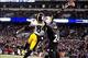 Nov 28, 2013; Baltimore, MD, USA; Pittsburgh Steelers wide receiver Antonio Brown (84) reaches for a pass over Baltimore Ravens cornerback Corey Graham (24) during a NFL football game on Thanksgiving at M&T Bank Stadium. Mandatory Credit: Evan Habeeb-USA