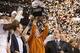 ARLINGTON, TX - DECEMBER 5: Head coach Mack Brown of the Texas Longhorns lifts the trophy after his teams 10-6 victory over the Nebraska Cornhuskers in the game at Cowboys Stadium on December 5, 2009 in Arlington, Texas. (Photo by Jamie Squire/Getty Image