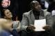 CHARLOTTE, NC - JANUARY 14: Charlotte Bobcats owner, Michael Jordan sits beside fiance, Yvette Prieto during the Golden State Warriors versus Charlotte Bobcats game at Time Warner Cable Arena on January 14, 2012 in Charlotte, North Carolina. NOTE TO USE