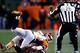 Nov 17, 2013; Denver, CO, USA; Denver Broncos cornerback Kayvon Webster (36) tackles Kansas City Chiefs quarterback Alex Smith (11) in the third quarter at Sports Authority Field at Mile High. The Broncos won 27-17. Mandatory Credit: Isaiah J. Downing-USA