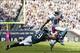 Oct 14, 2012; Philadelphia, PA, USA; Detroit Lions wide receiver Calvin Johnson (81) breaks the tackle of Philadelphia Eagles safety Nate Allen (29) during the fourth quarter at Lincoln Financial Field. The Lions defeated the Eagles 26-23 in overtime. Man