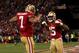 SAN FRANCISCO, CA - JANUARY 12: Quarterback Colin Kaepernick #7 of the San Francisco 49ers celebrates with wide receiver Michael Crabtree #15 after running the ball for a touchdown against the Green Bay Packers in the third quarter during the NFC Divisio