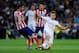 MADRID, SPAIN - SEPTEMBER 28: Asier Illarramendi of Real Madrid CF duels for the ball with Gabi Fernandez of Atletico de Madrid during the La Liga match between Real Madrid CF and Club Atletico de Madrid at Bernabeu on September 28, 2013 in Madrid, Spain