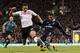 LONDON, ENGLAND - DECEMBER 1: Aaron Lennon of Tottenham competes for the ball with Stephen Kelly of Fulham during the Barclays Premier League match between Fulham and Tottenham Hotspur at Craven Cottage on December 1, 2012 in London, England. (Photo by