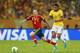 RIO DE JANEIRO, BRAZIL - JUNE 30: Andres Iniesta of Spain goes past Paulinho of Brazil during the FIFA Confederations Cup Brazil 2013 Final match between Brazil and Spain at Maracana on June 30, 2013 in Rio de Janeiro, Brazil. (Photo by Scott Heavey/Get