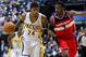 March 29, 2012; Indianapolis, IN, USA; Indiana Pacers shooting guard Paul George (24) brings the ball up court against Washington Wizards point guard John Wall (2) at Bankers Life Fieldhouse. Indiana defeated Washington 93-89. Mandatory credit: Michael Hi