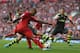 LIVERPOOL, ENGLAND - AUGUST 17: Glen Johnson of Liverpool shoots at goal during the Barclays Premier League match between Liverpool and Stoke City at Anfield on August 17, 2013 in Liverpool, England. (Photo by Clive Brunskill/Getty Images)