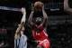 SAN ANTONIO, TX - NOVEMBER 30: James Harden #13 of the Houston Rockets goes to the basket against the San Antonio Spurs on November 30, 2013 at the AT&T Center in San Antonio, Texas. NOTE TO USER: User expressly acknowledges and agrees that, by downloadin