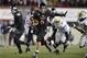 DEKALB, IL - NOVEMBER 26: Quarterback Jordan Lynch #6 of the Northern Illinois Huskies runs for 37-yards and a touchdown during the third quarter against the Western Michigan Broncos at Huskie Stadium on November 26, 2013 in DeKalb, Illinois. (Photo by