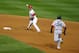 Shortstop Pete Kozma throws to first during Game 5 of the World Series.