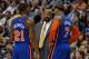 PHILADELPHIA, PA - MARCH 21: Head coach Mike Woodson of the New York Knicks talk with Iman Shumpert #21 and Carmelo Anthony #7 during the game against the Philadelphia 76ers at the Wells Fargo Center on March 21, 2012 in Philadelphia, Pennsylvania. The Kn