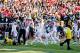 ANN ARBOR, MI - NOVEMBER 30: The Ohio State Buckeyes celebrate after stopping a Michigan Wolverines two point conversion in the fourth quarter during a game at Michigan Stadium on November 30, 2013 in Ann Arbor, Michigan. (Photo by Gregory Shamus/Getty
