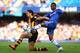 LONDON, ENGLAND - AUGUST 18: George Boyd of Hull City is challenged by Ashley Cole of Chelsea during the Barclays Premier League match between Chelsea and Hull City at Stamford Bridge on August 18, 2013 in London, England. (Photo by Clive Mason/Getty Im