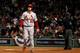 David Freese walks back to the dugout after striking out during the World Series.
