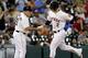 HOUSTON, TX - SEPTEMBER 18: Brandon Barnes #2 of the Houston Astros receives congratulations from Dave Trembley #47 of the Houston Astros after hitting a home run against the Cincinnati Reds in the third inning at Minute Maid Park on September 18, 2013