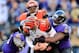 BALTIMORE, MD - NOVEMBER 10: Quarterback Andy Dalton #14 of the Cincinnati Bengals is sacked by outside linebacker Elvis Dumervil #58 of the Baltimore Ravens during the second half of the Ravens 20-17 overtime win at M&T Bank Stadium on November 10, 2013