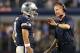 Nov 28, 2013; Arlington, TX, USA; Dallas Cowboys quarterback Tony Romo (9) talks with head coach Jason Garrett during a timeout from the game against the Oakland Raiders during a NFL football game on Thanksgiving at AT&T Stadium.The Cowboys beat the Raide