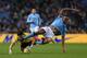 MANCHESTER, ENGLAND - JANUARY 05: Fernando Forestieri of Watford is tackled by Vincent Kompany of Manchester City during the FA Cup with Budweiser Third Round match between Manchester City and Watford at The Etihad Stadium on January 5, 2013 in Mancheste