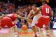 SYRACUSE, NY - DECEMBER 03: Tyler Ennis #11 of the Syracuse Orange has the ball knocked out of his hands by Evan Gordon #10 of the Indiana Hoosiers and Yogi Ferrell #11 of the Indiana Hoosiers during the first half at the Carrier Dome on December 3, 2013