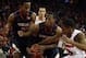 Nov 28, 2012; Madison, WI, USA; Virginia Cavaliers forward Akil Mitchell (center) goes for the rebound with Wisconsin Badgers guard George Marshall (3) during the first half at the Kohl Center. Mandatory Credit: Mary Langenfeld-USA TODAY Sports